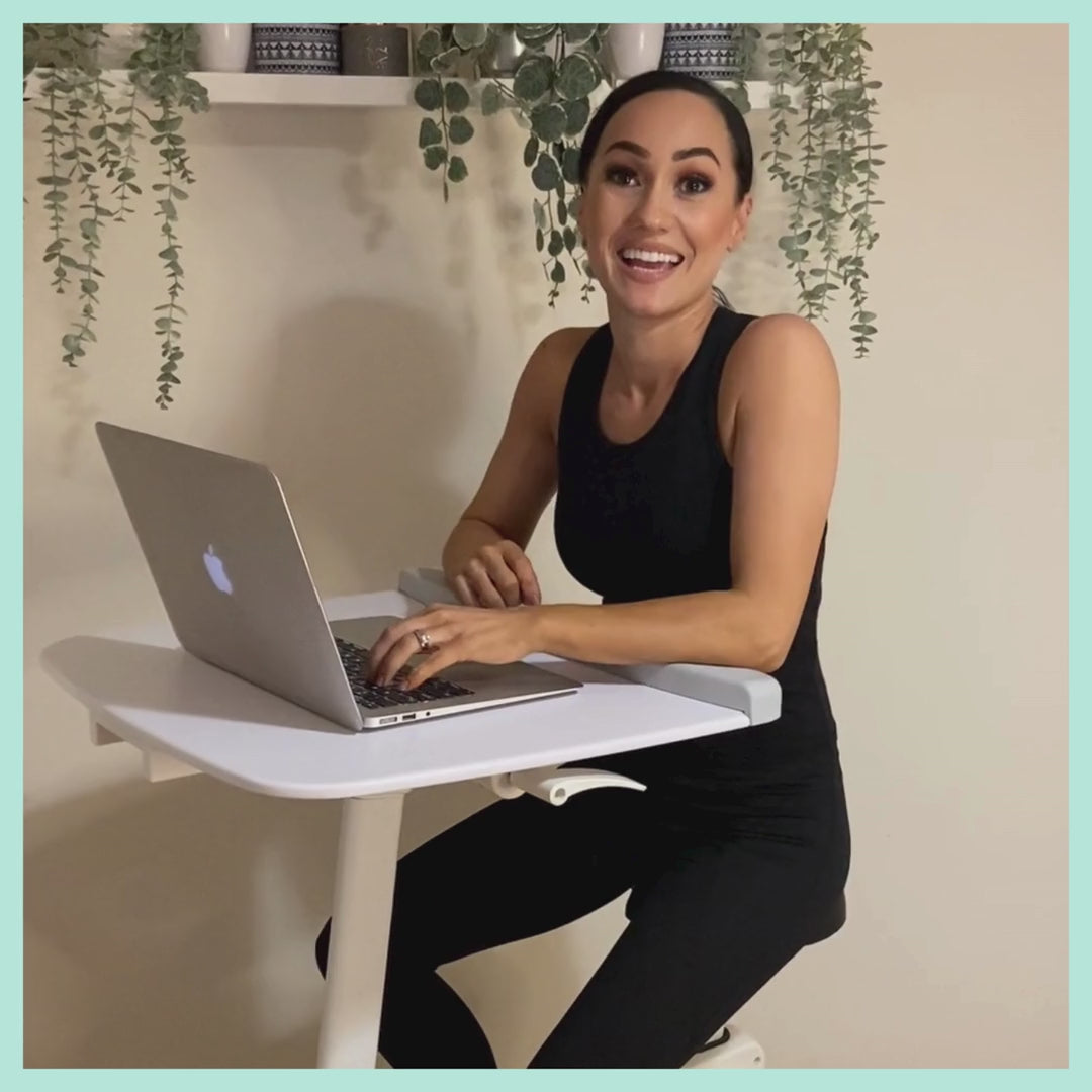 video of woman on bikedesk exercising whilst using laptop